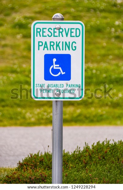 EVERETT,\
WA, USA - JUNE 2018: Sign in a parking bay reserved for disabled\
persons at the Boeing Visitor Centre in\
Everett.
