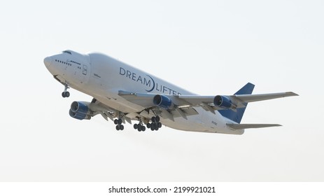 Everett, WA, USA - September 02, 2022; Boeing Dreamlifter Aircraft Isolated On Takeoff Against White Sky