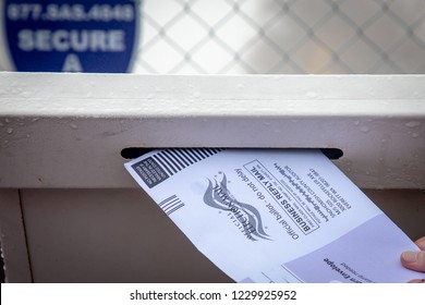 Everett, Washington / USA - 10/27/2018 - Putting A Mail In Ballot Into The Drop Off Ballot Box