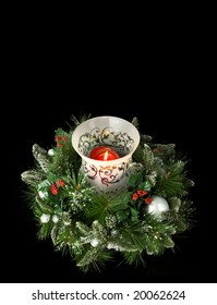 Evergreen Centerpiece Candle With Greenery, Isolated On Black, Lots Of Room For Copy