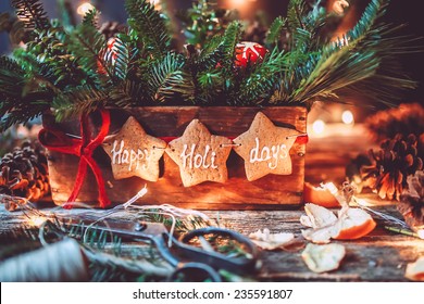 Evergreen Christmas Centerpiece With Happy Holidays Gingerbread Cookies And Lights 