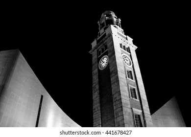 Everlasting Time - Clocktower In Front Of Museum At Tsim Sha Tsui, Hong Kong City, Victoria Harbour In Monochrome