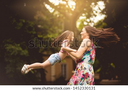 Every common moment is remembered forever. Mother and daughter outdoor.
