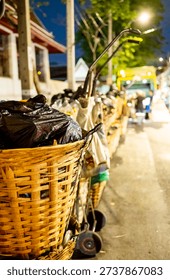 Every evening rows of black bin bags,loaded with trash,waste and garbage line the streets,before being taken by the municipal refuse collection dustcart.