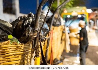 Every evening rows of black bin bags,loaded with trash,waste and garbage line the streets,before being taken by the municipal refuse collection dustcart.