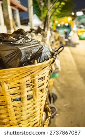 Every evening rows of black bin bags,loaded with trash,waste and garbage line the streets,before being taken by the municipal refuse collection dustcart.