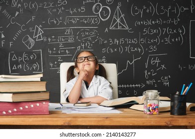 Every kid is a genius at something. Shot of an academically gifted young girl working in her classroom. - Shutterstock ID 2140143277