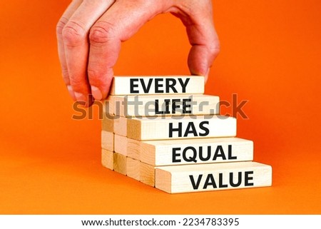 Every life has equal value symbol. Concept words Every life has equal value on wooden blocks. Businessman hand. Beautiful orange background. Business and every life has equal value concept. Copy space