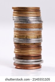 Every Little Bit Helps. Studio Shot Of A Stack Of Coins On A White Background.