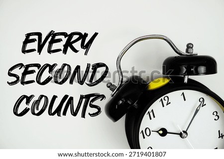 Every Second Counts text with alarm clock flat lay on white background