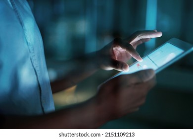 Every tap keeps him on task. Shot of an unrecognisable businesswoman using a digital tablet during a late night at work. - Powered by Shutterstock