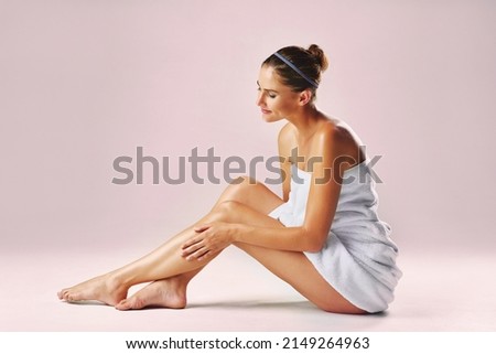 Every womans dreams, smooth and soft legs. Studio shot of an attractive woman showing off her beautiful legs against a pink background.
