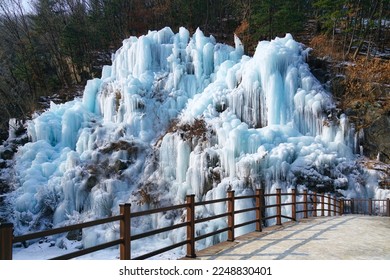 Every year in January at Eobi Ice Valley, South Korea, a beautiful iced wall formed by a frozen waterfall shows a cascade of ice and icicles. - Powered by Shutterstock