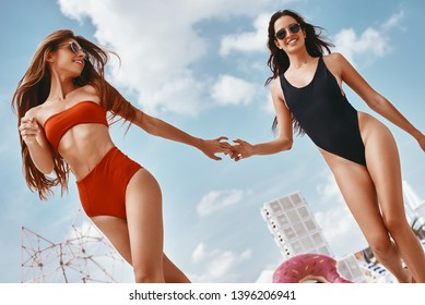 Everyday Can Be A Party. Girls Having Fun At The Rooftop Swimming Pool