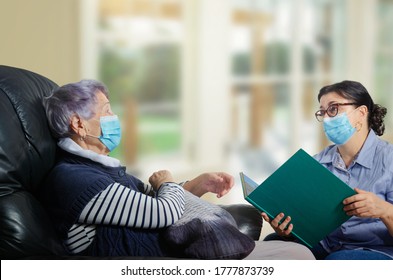 An everyday female caregiver reads books for an elderly woman. The corona-virus pandemic has made a difference. Both wearing face masks and keep their distance.