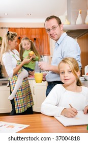 Everyday Life Of A Family - Kids Doing Their Homework In The Kitchen Before Going To School