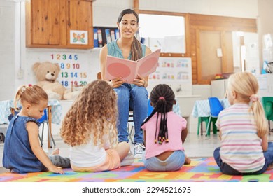 Everyone loves story time. Shot of a young woman reading to her preschool students. - Shutterstock ID 2294521695