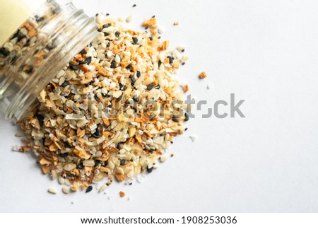 Everything Bagel Seasoning Spilled from a Spice Jar