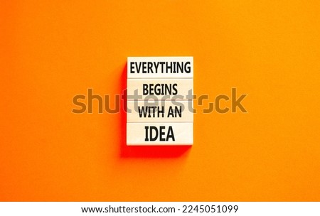 Everything begins with an idea symbol. Concept word Everything begins with an idea on wooden blocks. Beautiful orange table orange background. Business everything begins with idea concept. Copy space