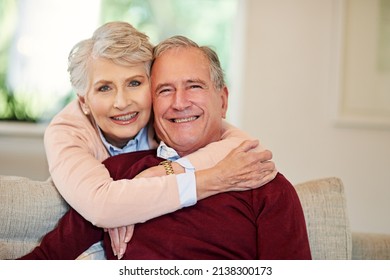 Everything Is Better When Were Together. Shot Of A Senior Woman Embracing Her Husband From Behind.