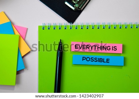 Everything is Possible text on sticky notes with office desk concept