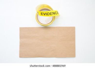 Evidence Marker Tape And Brown Paper Bag For Crime Scene  Isolated With Blank And Copy Space