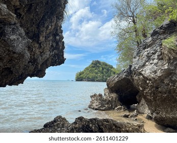 EView of the entrance to Sra Namtip Cave in Thailand, featuring unique rock formations and a rugged natural pathway leading into the dark interior of the cave. Krabi april 2025. - Powered by Shutterstock - Get 15% off with code: PIKWIZARD15
