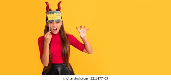 evil child in imp horns with party accessory. Halloween kid girl portrait, horizontal poster. Banner header with copy space. - Shutterstock ID 2216177405