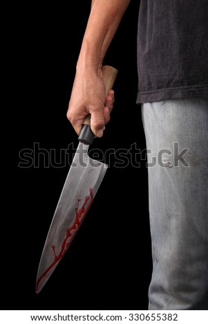 Evil criminal with large sharp knife ready for robbery or to commit a homicide isolated with clipping path inside