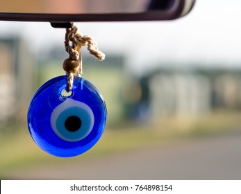 Evil Eye Beads Hanging From The Rearview Mirror (Turkish Tradition)