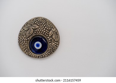 Evil Eye, A Turkish Silver Evil Eye Talisman Isolated Over A White Background	