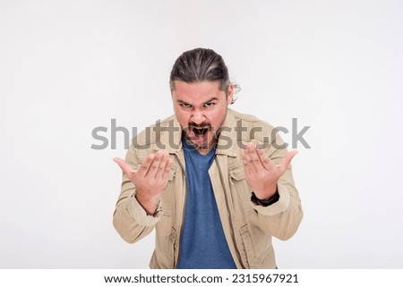 An evil man with his hands up daring someone to come at him. A taunting gesture to provoke an enemy. Isolated on a white background.