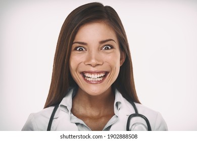 Evil smile mean psychopath doctor concept. Scary crazy Asian professional portrait woman smiling with a malicious laugh looking insane.