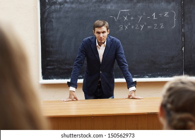 Evil Teacher At The Blackboard With The Words