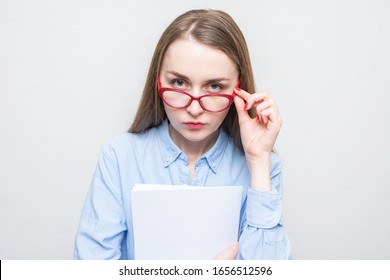 Evil Teacher Woman Takes Off Her Glasses, Woman With Homeworks Of Her Students, Portrait, White Background