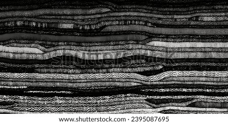 Evoke a sense of timeless elegance with this grayscale background, meticulously crafted from a stack of traditional fabrics.The monochromatic richness adds a touch of sophistication, making it an idea
