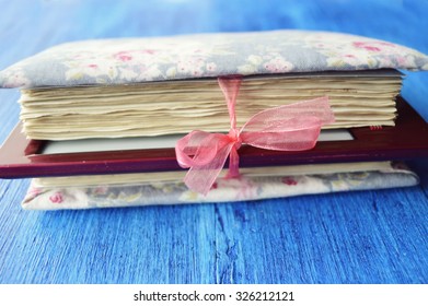 Evolution of books.eBook connected to the  book with a cable, and download information from there on a light background