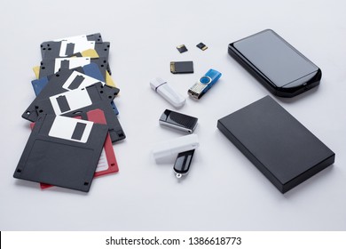 The evolution of digital devices for the transfer and storage of information. Objects isolated on white background.