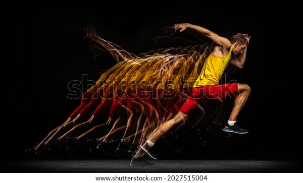 Evolution of movements. Portrait of young man,\
professional male athlete, runner in action isolated on dark\
background. Stroboscope effect. Concept of healthy lifestyle,\
sport, achievements, goal,\
ad.