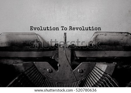 Evolution To Revolution typed words on a vintage typewriter