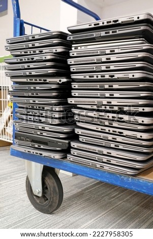 Image, Stock Photo Stack of laptops in the storage room of a company