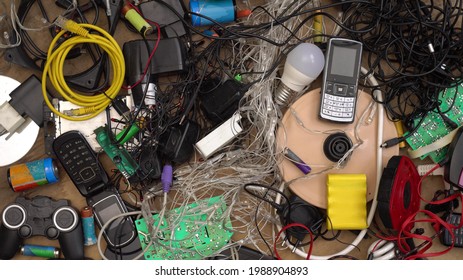 E-waste And Hazardous Waste Sorting And Disposal. Old Broken Phones, Battery, Computers And Electronics. Heavy Metal Pollution. Used Electrical Devices And Obsolete Electronic Equipment