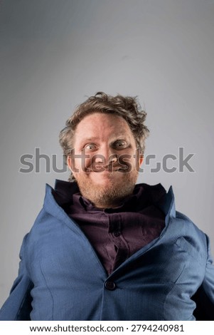 Exaggerated Comedic Expression in Blue Suit Jacket