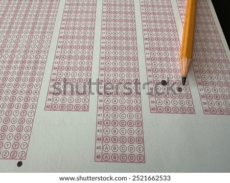 Exam answer sheet. Exam, optical reader and pencil. Test concept. Exam center hall student teacher time important optical paper question marks marking tick. Selective focus. Exam optic paper.