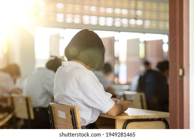 Exam Or Assessment Of Students Concept, Behind Student In Classroom Sitting On Chair, White Uniform Of School, Asain People In Test For Registration Test Of Knowledge