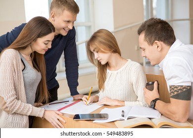 Exam Prep. Group Of Student Friends Studying Together In A Classroom Preparing For Exams College University Team Teenager Together Education People Youth Smart Studying Campus High School Concept