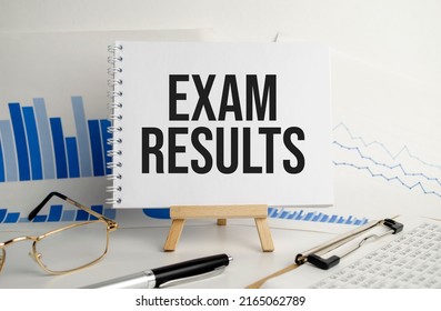 exam results words on notebook and pen on white background - Shutterstock ID 2165062789