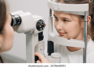 Examination of the child using a slit lamp. Microscope and focused light source. A device for high-precision examination of the eye to determine the condition of the lens. - Powered by Shutterstock