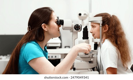 Examination of the child using a slit lamp. Microscope and focused light source. A device for high-precision examination of the eye to determine the condition of the lens. - Powered by Shutterstock