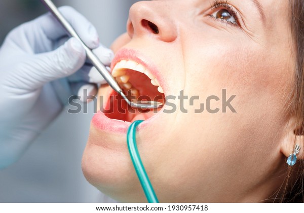 Examination oral cavity or treatment teeth,
visiting dental office, soft focus
background
